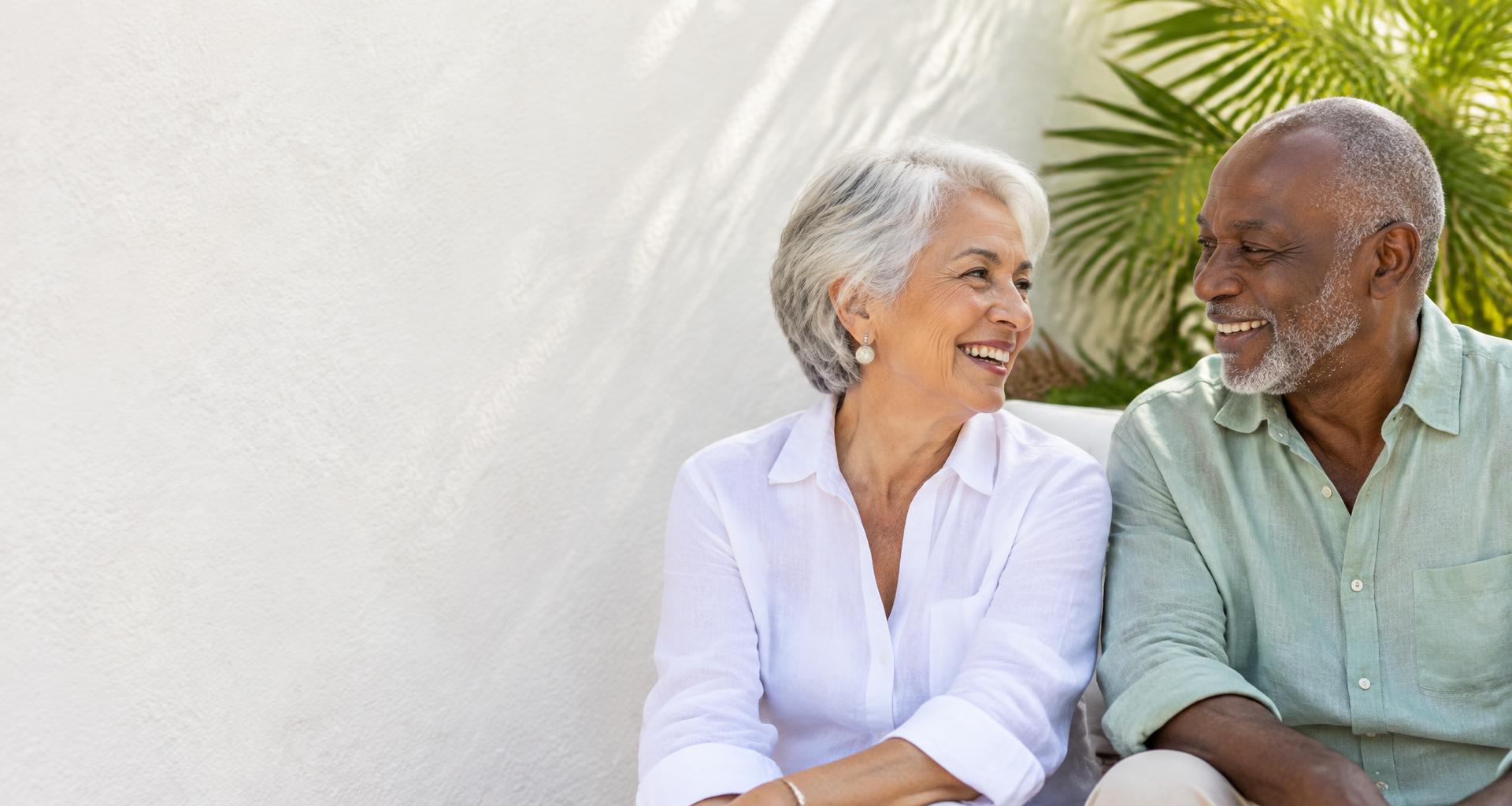 Two seniors sharing a happy moment outdoors
